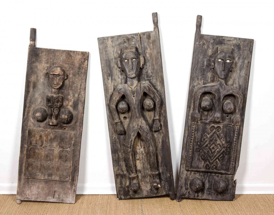 Three Indonesian Carved Wood Door Panels, Height of: Three Indonesian Carved Wood Door Panels, each with figural carving, having inset bone eyes. Height of each 60 x width 18 1/2 inches. The Hascoe Collection