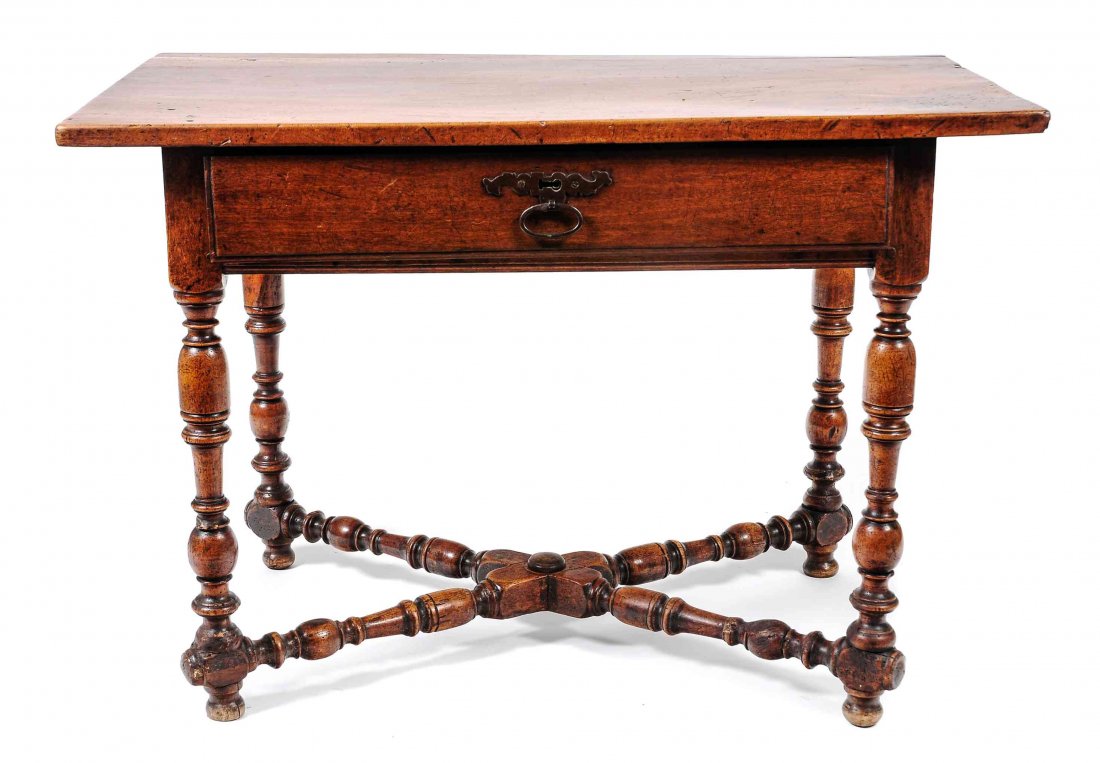 An English Walnut Side Table, Height 28 1/2 x width 41: An English Walnut Side Table, the rectangular top over the frieze set with one long drawer above turned legs joined by an X-form stretcher. Height 28 1/2 x width 41 1/2 x depth 21 inches.