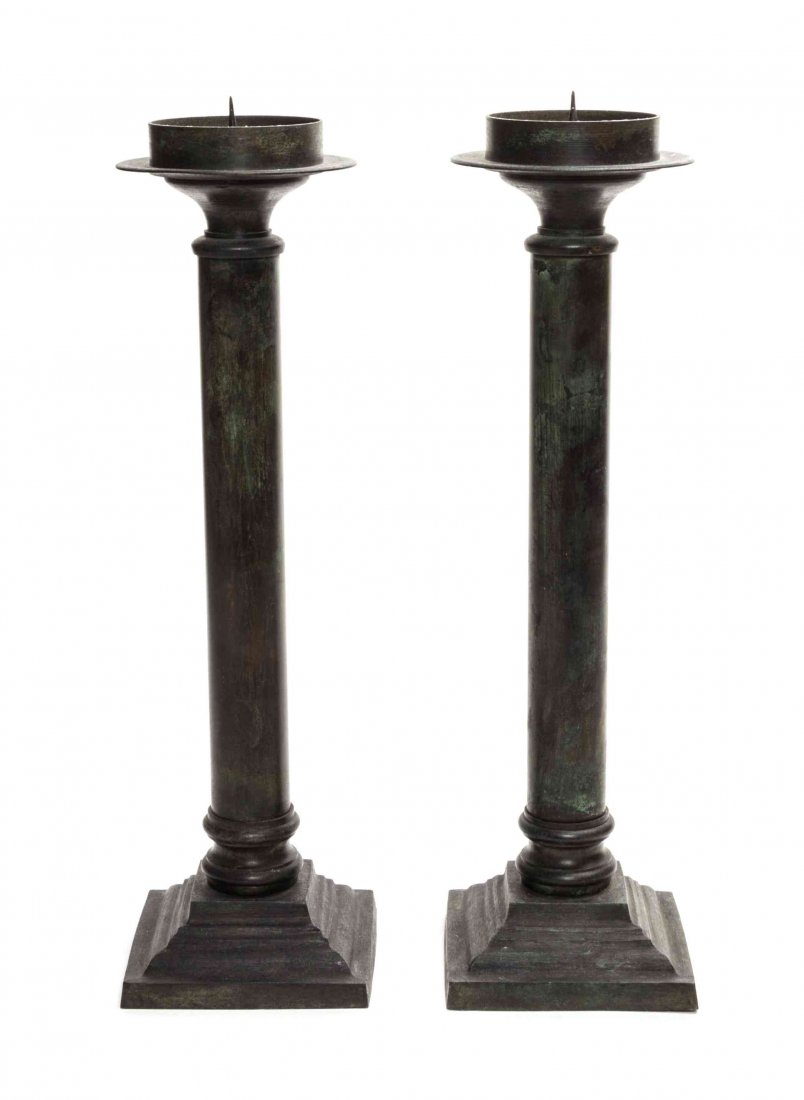 A Pair of Bronzed Metal Candlesticks, Height 16 1/2: A Pair of Bronzed Metal Candlesticks, each of columnar form set on a square base. Height 16 1/2 inches.