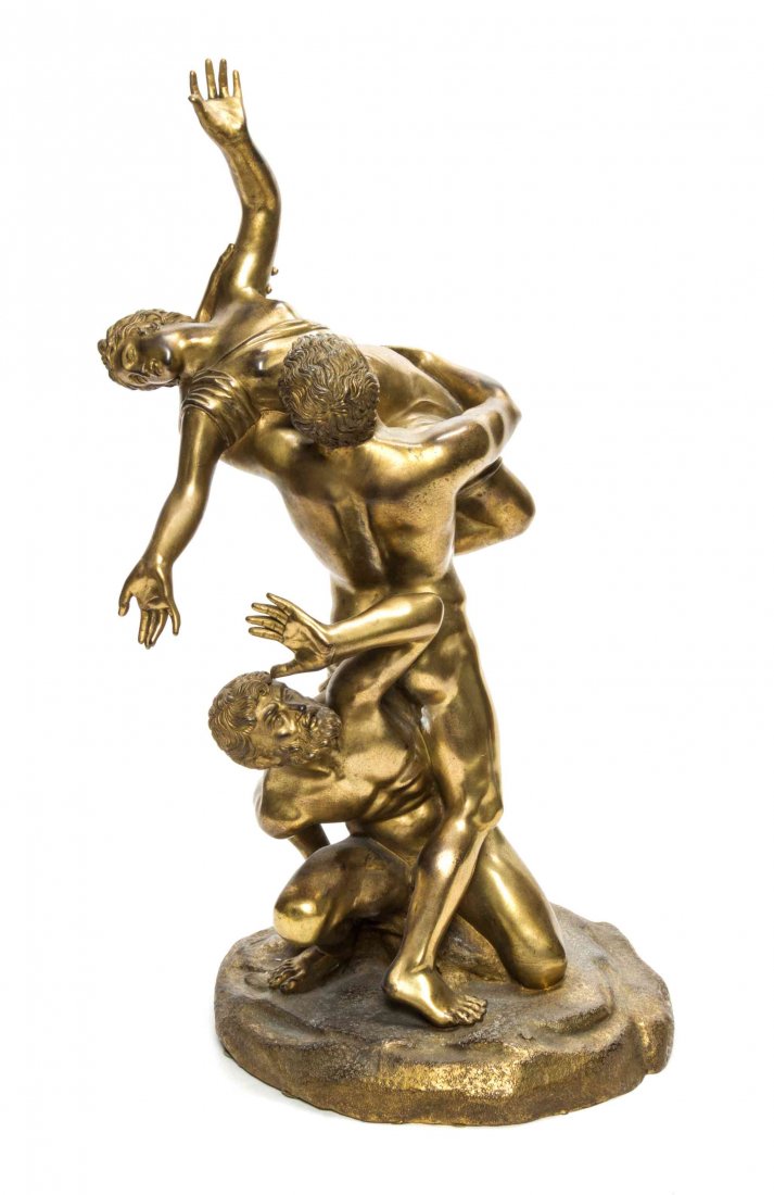 A Cast Metal Allegorical Group, Height 18 inches.: A Cast Metal Allegorical Group, having gilt patina, depicting two men and a woman engaged in a struggle. Height 18 inches.