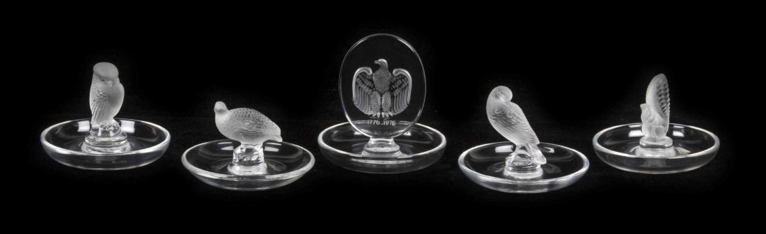 Five Lalique Molded and Frosted Glass Ring Trays,: Five Lalique Molded and Frosted Glass Ring Trays, in various patterns, comprising four bird examples and a squirrel, each with various signatures. Height 4 inches. Property from the Frank Plevo Trust,