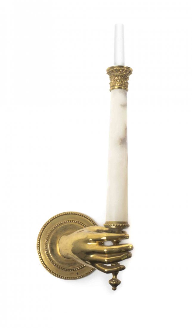 A Neoclassical Brass and Alabaster Sconce, Height 22: A Neoclassical Brass and Alabaster Sconce, the circular backplate issuing a hand form support holding the columnar form standard. Height 22 inches.