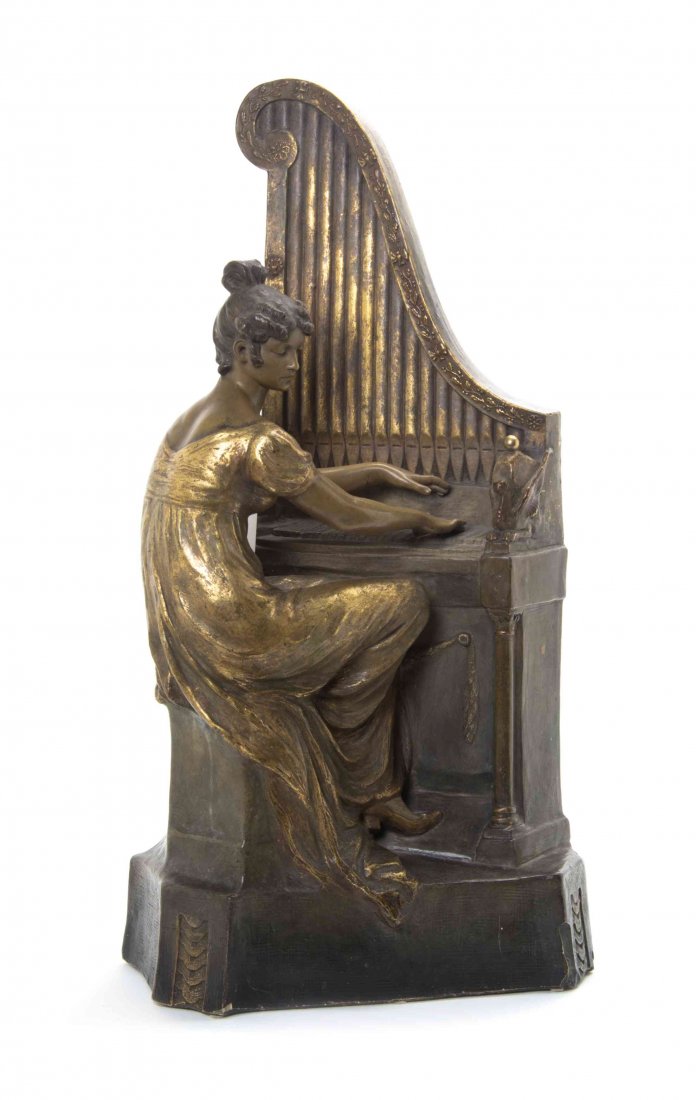 A Goldscheider Terra Cotta Figure, Height overall 27: A Goldscheider Terra Cotta Figure, depicting a woman playing an upright piano, numbered 9762. Height overall 27 3/4 inches.