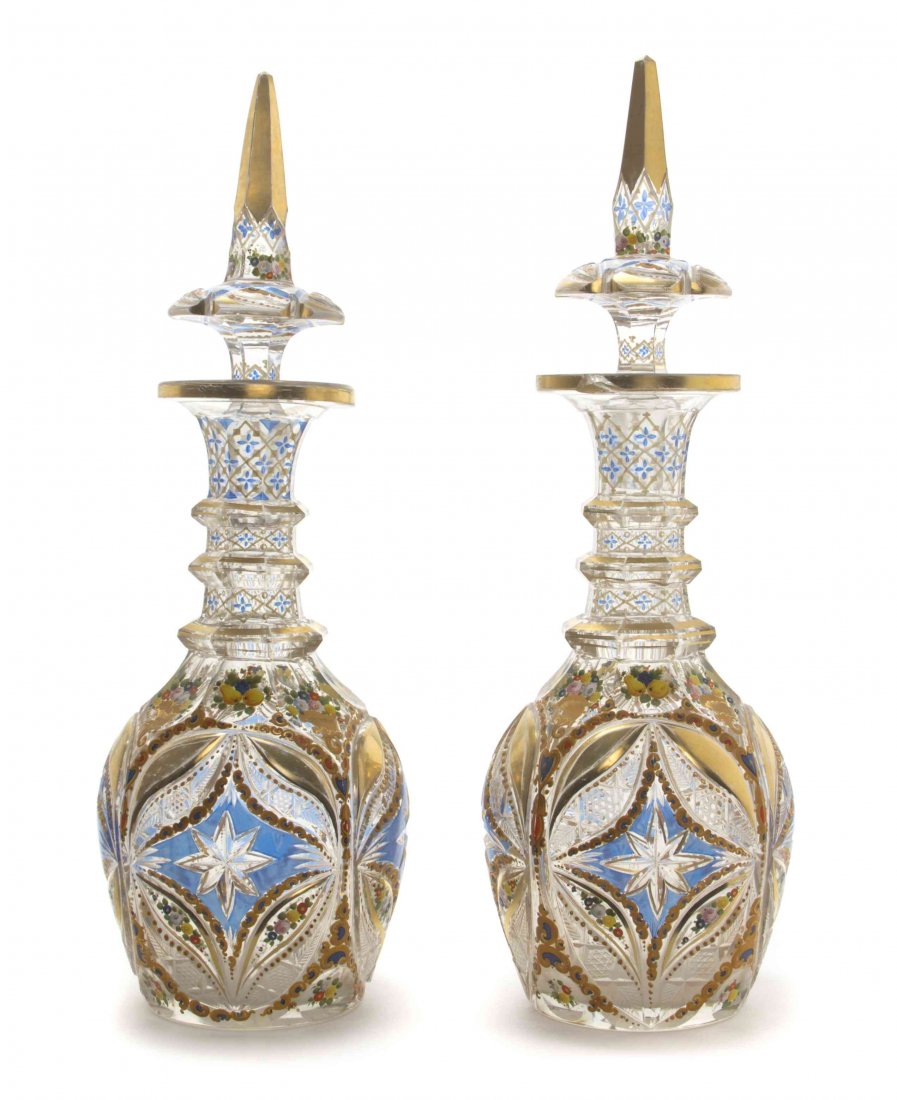 A Pair of Bohemian Enameled Cut Glass Decanters, 19TH: A Pair of Bohemian Enameled Cut Glass Decanters, 19TH CENTURY, FOR THE TURKISH MARKET, each of baluster form with a spire finial, painted throughout to show floral sprays and arabesques. Height 18 inc