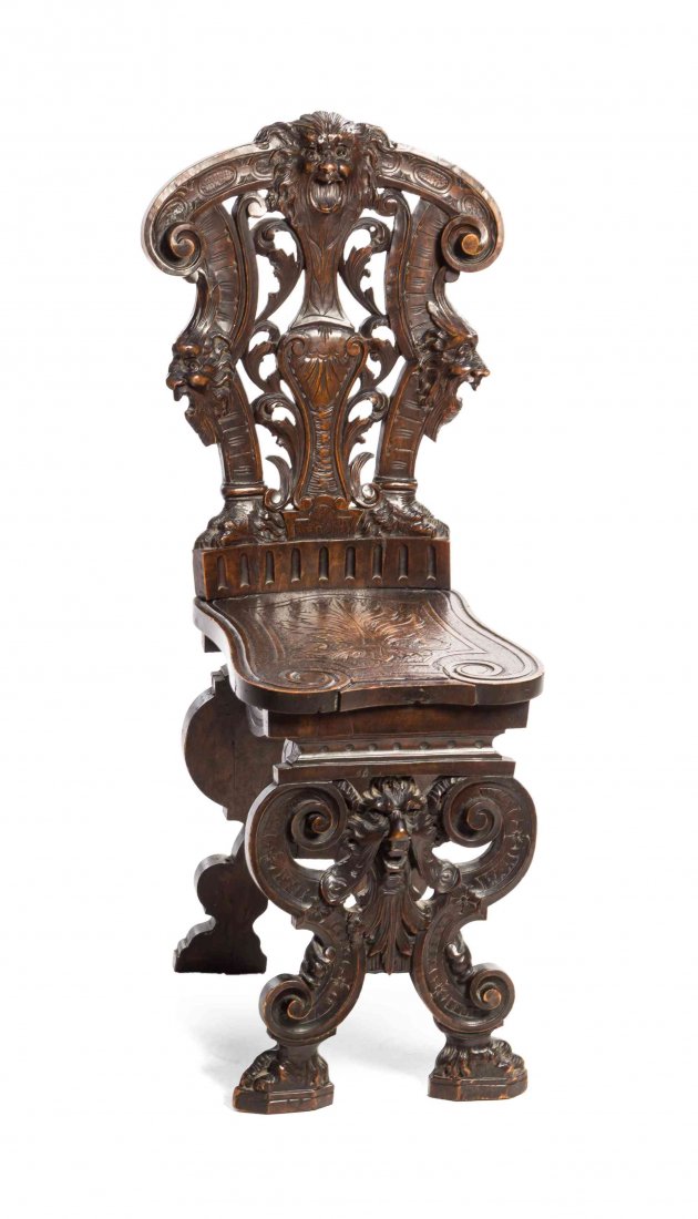 A Renaissance Revival Carved Hall Chair, 19TH CENTURY,: A Renaissance Revival Carved Hall Chair, 19TH CENTURY, worked to show grotesque masks and foliate scrolls. Height 38 inches. Property from the Estate of a Prominent Midwest Collector