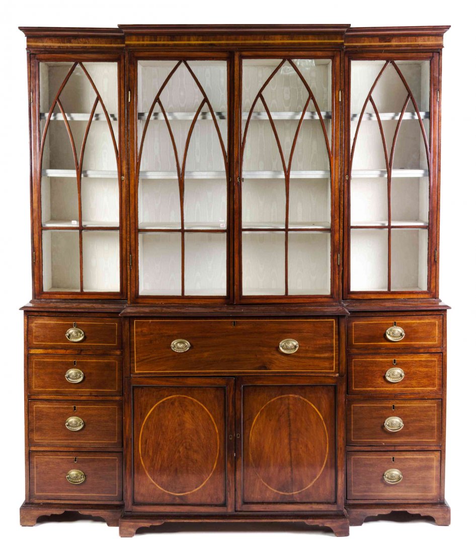 A Regency Mahogany Secretary Bookcase, Height 92 x widt: A Regency Mahogany Secretary Bookcase, having a molded cornice and line inlaid frieze over glazed doors with mullion arranged in lancet arch form, the base having a secretary drawer opening to a fitte