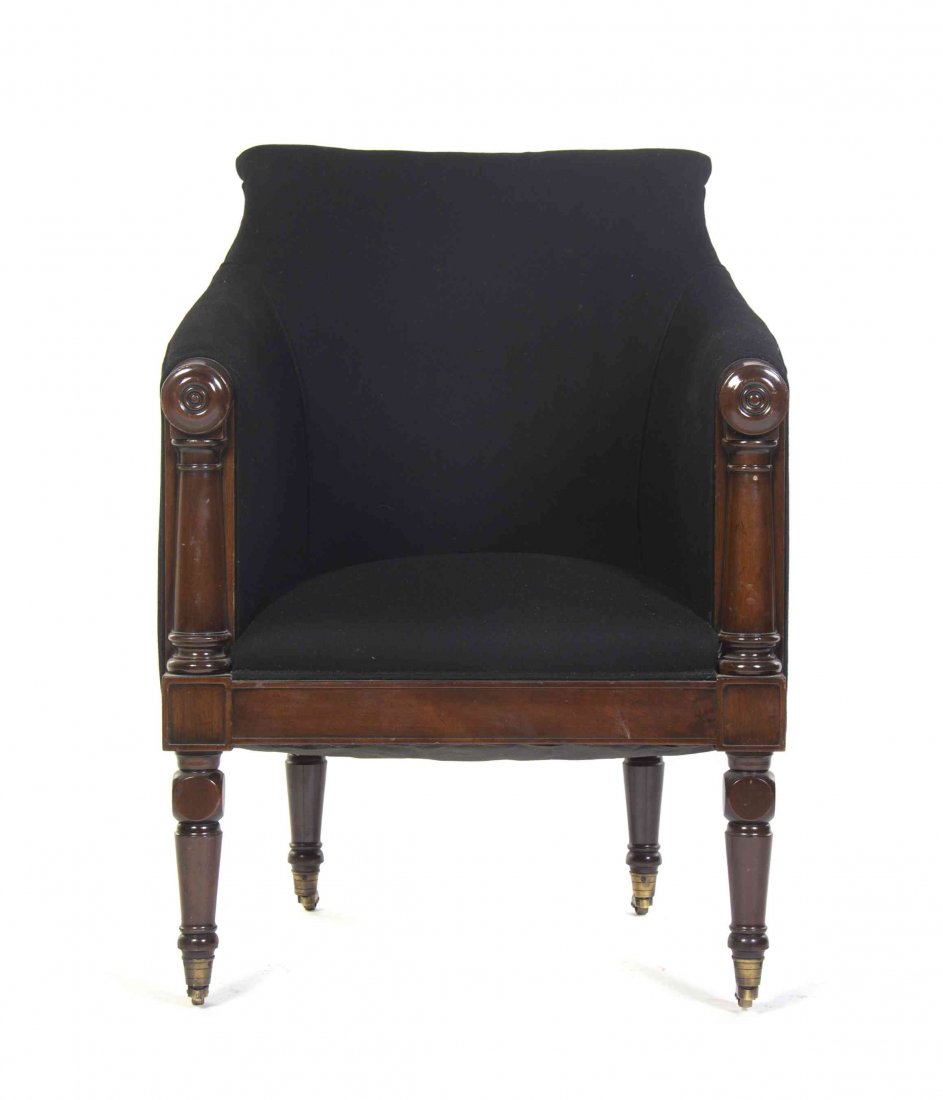 A William IV Mahogany Armchair, Height 35 inches.: A William IV Mahogany Armchair, having an upholstered back, arms and seat, raised on tapering turned legs terminating in casters. Height 35 inches.