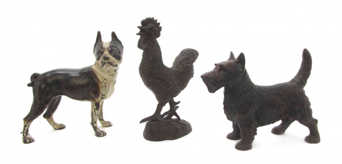 Three Cast Iron Doorstops, Height of tallest 12 inches.: Three Cast Iron Doorstops, depicting a Boston Terrier, a Cairn Terrier, and a rooster. Height of tallest 12 inches. Property from the Estate of Robert P. Stupp, Saint Louis, Missouri