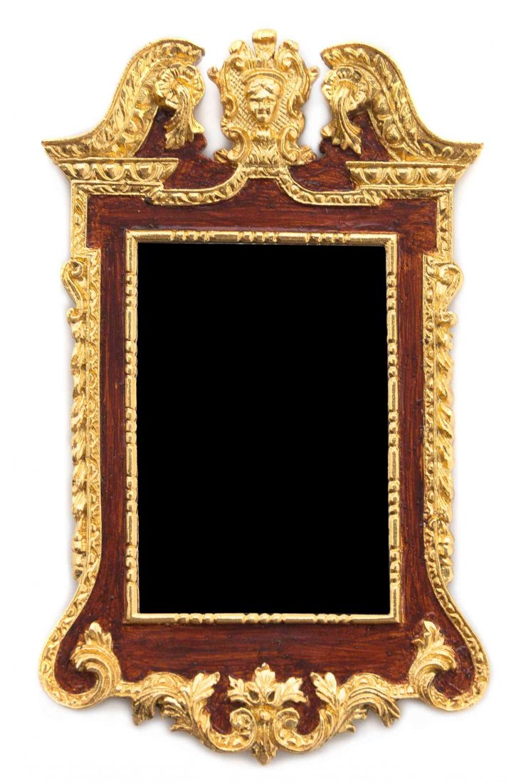 An Early Georgian Style Gilt Decorated Composite: An Early Georgian Style Gilt Decorated Composite Mirror, JOHN J. HODGSON, 1998, having a rectangular mirror plate within a shaped foliate scroll decorated frame, surmounted by a broken swan neck pedim