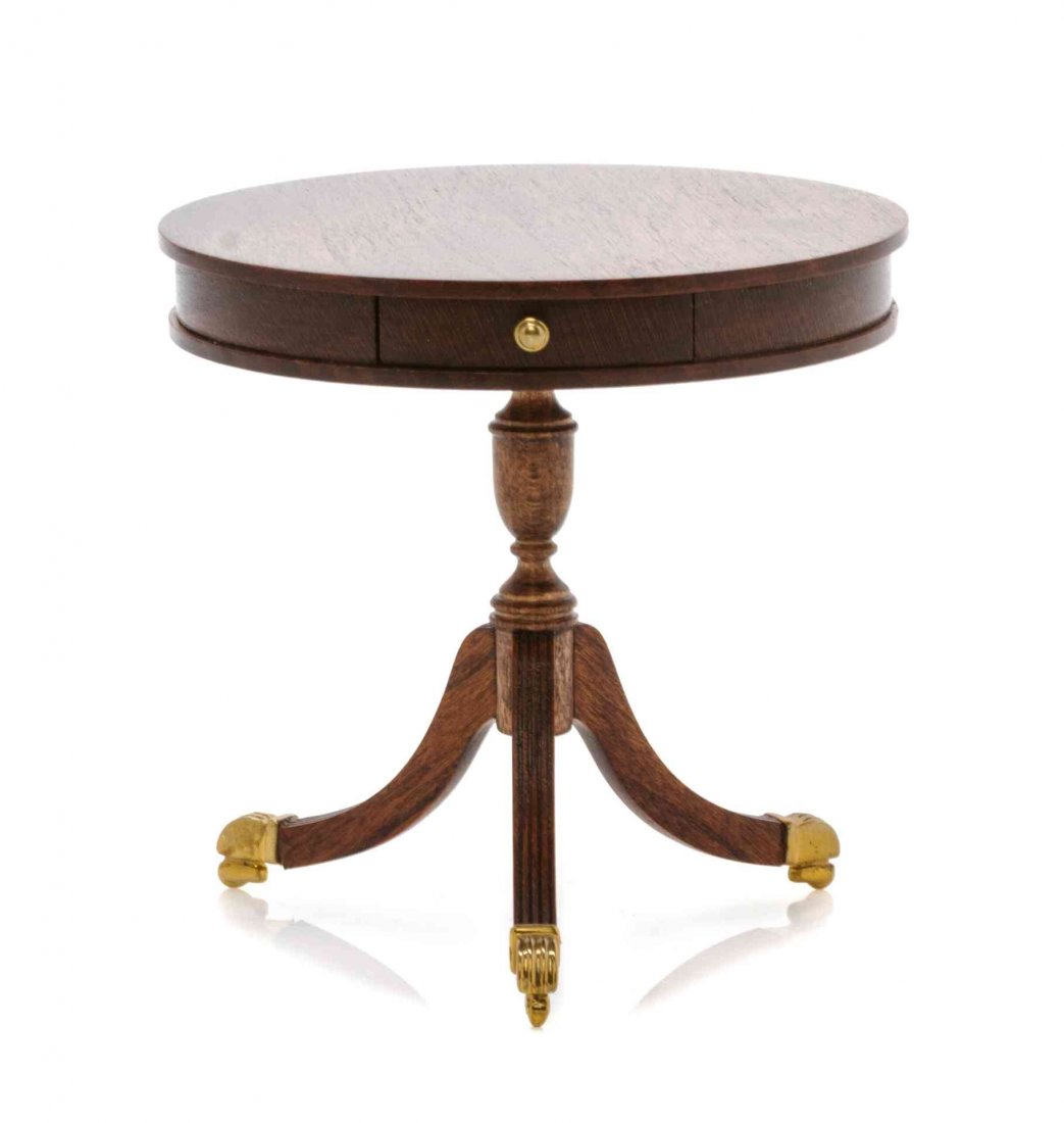 A Regency Style Mahogany Drum Table, Height 2 1/2 x: A Regency Style Mahogany Drum Table, ROGER L. GUTHEIL, 1995, having a circular top over two opposing frieze drawers, raised on a vasiform support above reeded outsplayed legs ending in caps and caster