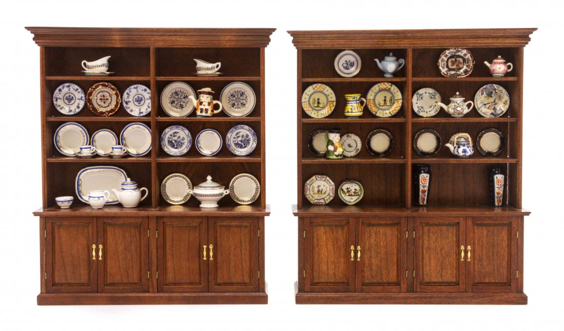 A Pair of George III Style Mahogany China Cabinets,: A Pair of George III Style Mahogany China Cabinets, ROGER L. GUTHEIL, 1984 AND 1993, each having a rectangular molded cornice over a shelved interior set with various decorative articles, over a lower