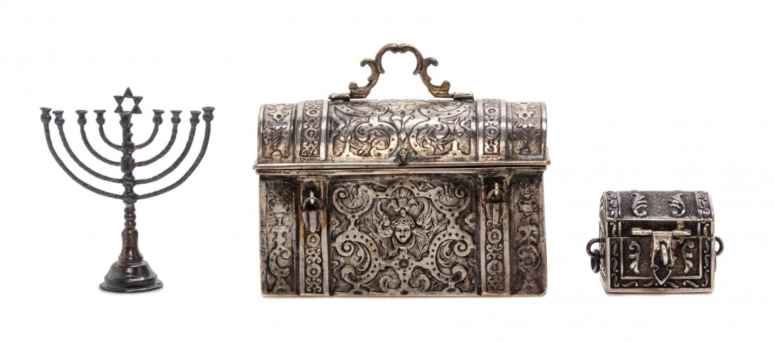 A German Silver Chest and Menorah, Length of German: A German Silver Chest and Menorah, LATE 19TH/EARLY 20TH CENTURY, the rectangular chest with hinged domed top, chased overall with baroque strapwork and grotesques, gilt interior, Georg Roth & Co., Han