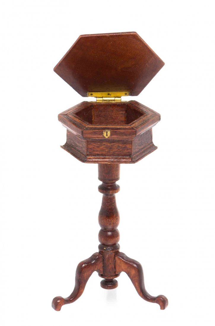 A Georgian Style Tea Poy, Height 2 7/8 inches.: A Georgian Style Tea Poy, W. BRADLEY, 1981, having a hinged hexagonal top raised on a turned baluster support ending in a tripod base. Height 2 7/8 inches. Property from the Collection of Cookie Ziemb