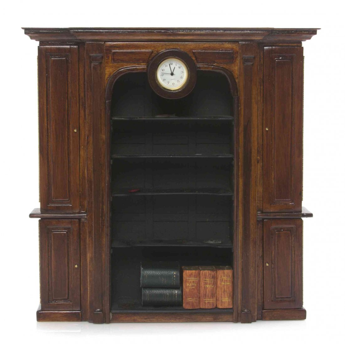 An English Style Bibliotheque, Height 7 1/2 x width 7: An English Style Bibliotheque, CARL ISABELLE, having a projecting molded cornice above an inset clock with quartz movement, with five inset shelves flanked by columnar pilasters and paneled doors open