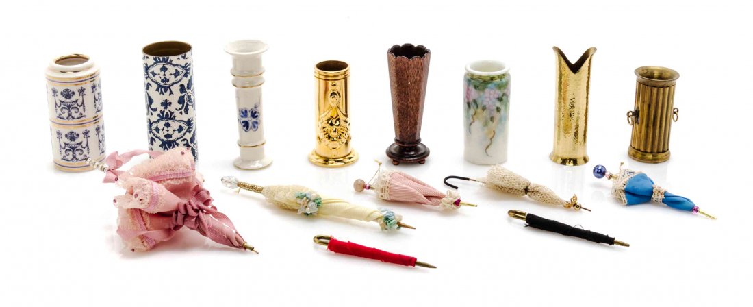 A Collection of Umbrellas and Stands, Height of tallest: A Collection of Umbrellas and Stands, comprising seven umbrellas and eight stands, 15 items total. Height of tallest stand 1 7/8 inches. Property from the Estate of Eunice Gold, Chicago, Illinois