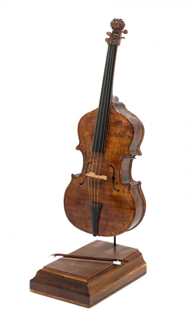 A Bass Viol, Height of violin 6 1/4 inches.: A Bass Viol, KEN MANNING, with bow, raised on a plinth base with a metal stand. Height of violin 6 1/4 inches. Property from the Collection of Cookie Ziemba, Lake Worth, Florida