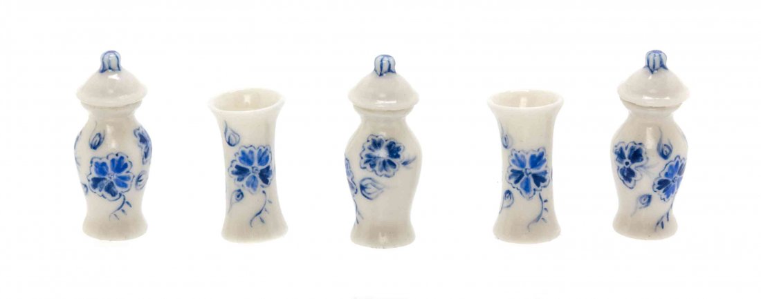 A Dutch Style Porcelain Garniture, Height of first 1: A Dutch Style Porcelain Garniture, JENNIFER AND HERBERT BENNETT, comprising three baluster form covered urns and two vases, each painted to show floral sprays and initialed JBH to the underside. Heigh
