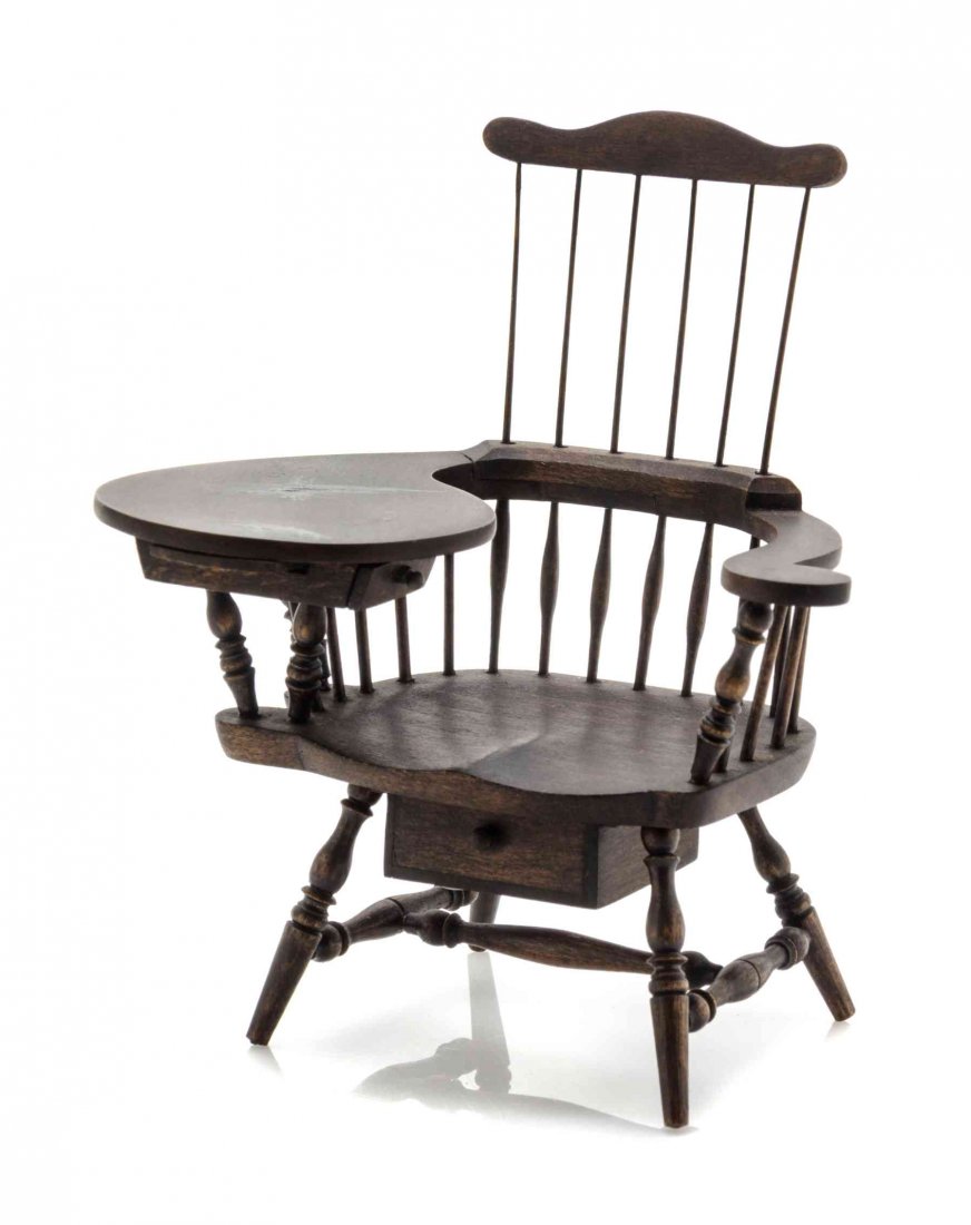 An American Comb-Back Windsor Chair, Height 3 5/8: An American Comb-Back Windsor Chair, BIRKMEIER STUDIO, one arm forming a writing surface with a drawer, having an additional drawer beneath the seat, raised on turned legs joined by stretchers. Height