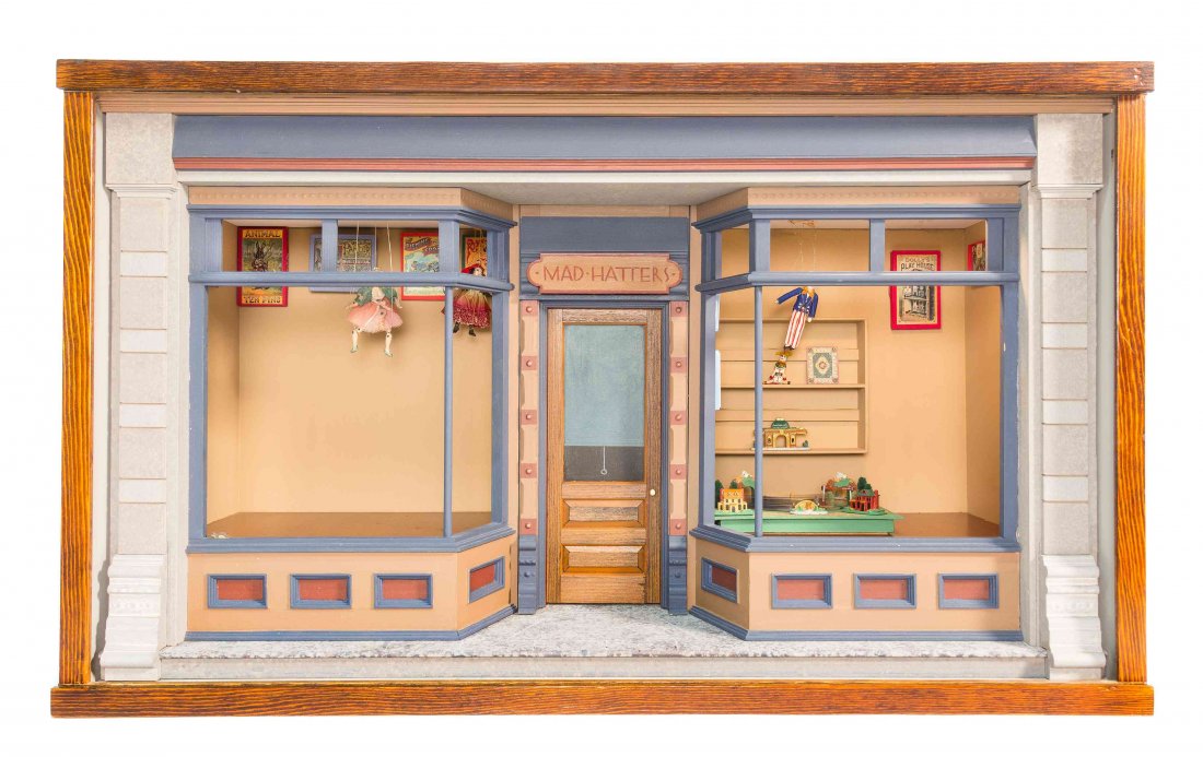Mad Hatter's Toy Shop, Height 14 x width 23 1/2 x depth: Mad Hatter's Toy Shop, contained in a glass-fronted box, the interior with a model train set and other display articles. Height 14 x width 23 1/2 x depth 10 1/2 inches. Property from the Collection of