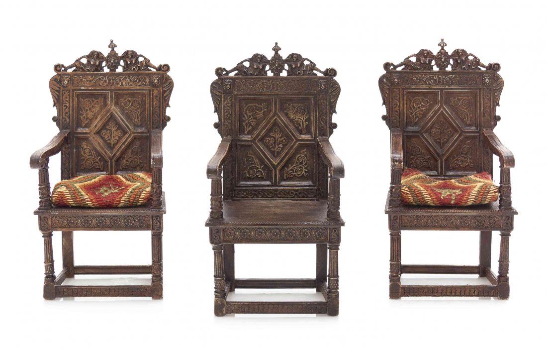 A Set of Three James I Style Metal Armchairs, Height 4: A Set of Three James I Style Metal Armchairs, MARK MODELS LTD., each with a figural crest over the plank back and seat, raised on turned legs joined by stretchers. Height 4 1/8 inches. Property from t