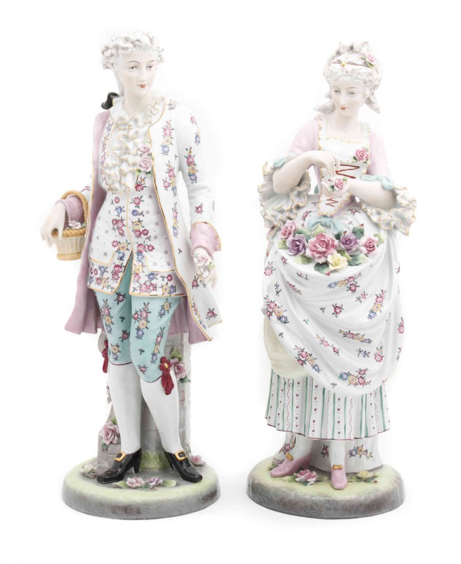 Two German Porcelain Figures, Height of each 22 inches.: Two German Porcelain Figures, 20TH CENTURY, one depicting a lady and the other a gentleman, each in 18th century attire, each bearing a spurious crossed swords mark to the underside. Height of each 22