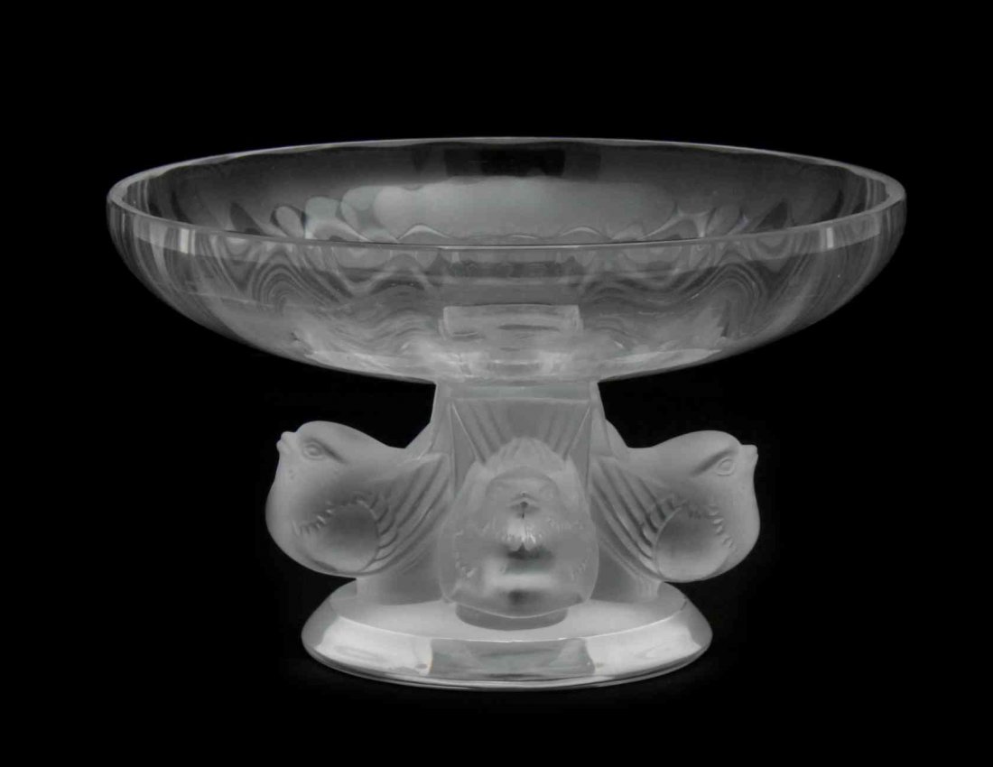 A Lalique Molded and Frosted Glass Compote, Height 3: A Lalique Molded and Frosted Glass Compote, Nogent, the base with four birds, raised on a circular foot. Height 3 1/4 x diameter 5 1/2 inches.