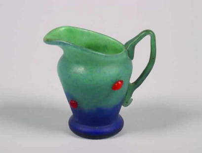 A Mottled Glass Ewer,: A Mottled Glass Ewer, the body applied with glass insects, inscribed"Daum France".Height 4 1/2 inches.