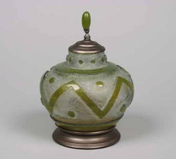A Daum Glass Vase,: A Daum Glass Vase, the ovoid body decorated with a geometric design, mounted as a table lamp, signed Daum Nancy, France.Height 11 1/4 inches.