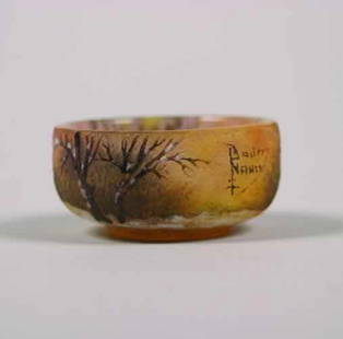 A Daum Etched and Enameled miniature bow: A Daum Etched and Enameled miniature bowl, decorated with a winter landscape, signed ""DaumNancy"" with the cross of Lorraine, in a fitted box.Height 1 inch, diameter 2 1/8 inches.