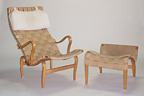 BRUNO MATHSSON LOUNGE & OTTOMAN Made by: BRUNO MATHSSON LOUNGE & OTTOMAN Made by Karl Mathsson Laminated wood, cotton; branded marks and dated 1967 to each; chair h: 36, w: 25 1/2, d: 39 in, ottoman h: 16, l: 26, w: 20 in.