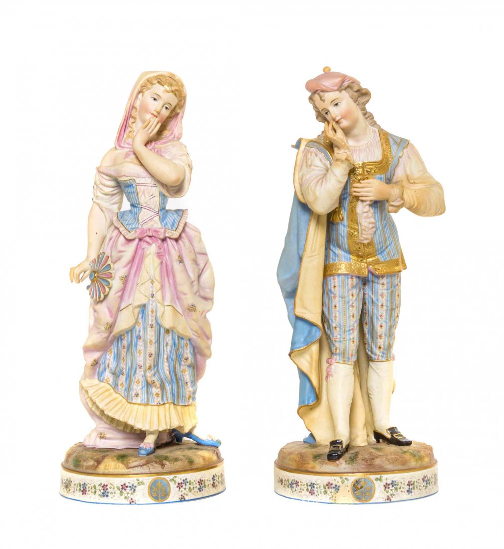 A Pair of Royal Dux Figures, Height of taller 21 1/2: A Pair of Royal Dux Figures, depicting a lady and a gentleman in Victorian costume. Height of taller 21 1/2 inches.