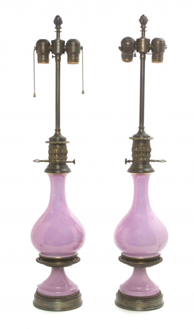 A Pair of Porcelain Table Lamps, Height overall 30: A Pair of Porcelain Table Lamps, each with iridescent glaze on a pink ground. Height overall 30 inches. Property of a Lady, St. Augustine, Florida