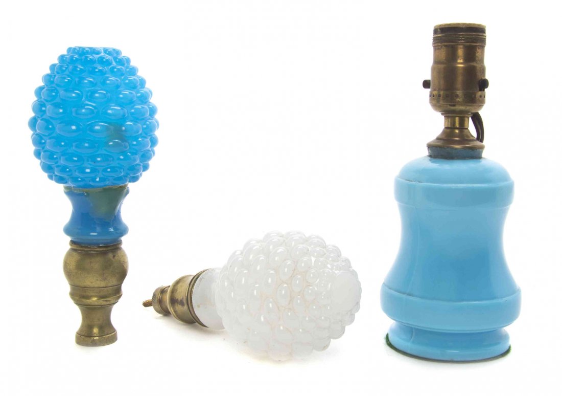 A French Opaline Glass Table Lamp, Height of lamp: A French Opaline Glass Table Lamp, of baluster form, together with two opaline glass finials. Height of lamp overall 7 7/8 inches.