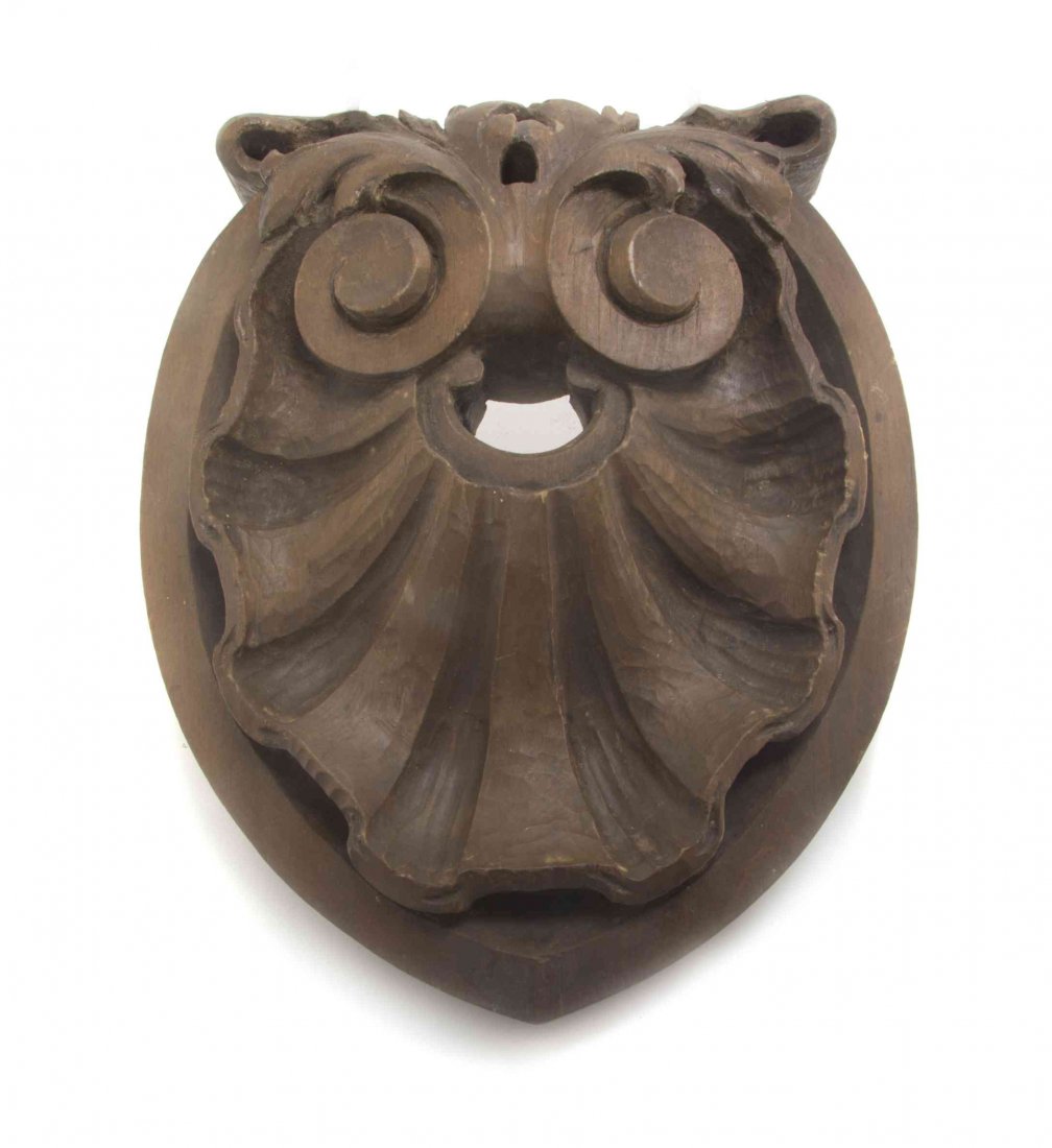 A Continental Carved Wood Ornament, Height 12 1/4: A Continental Carved Wood Ornament, depicting a stylized shell. Height 12 1/4 inches.