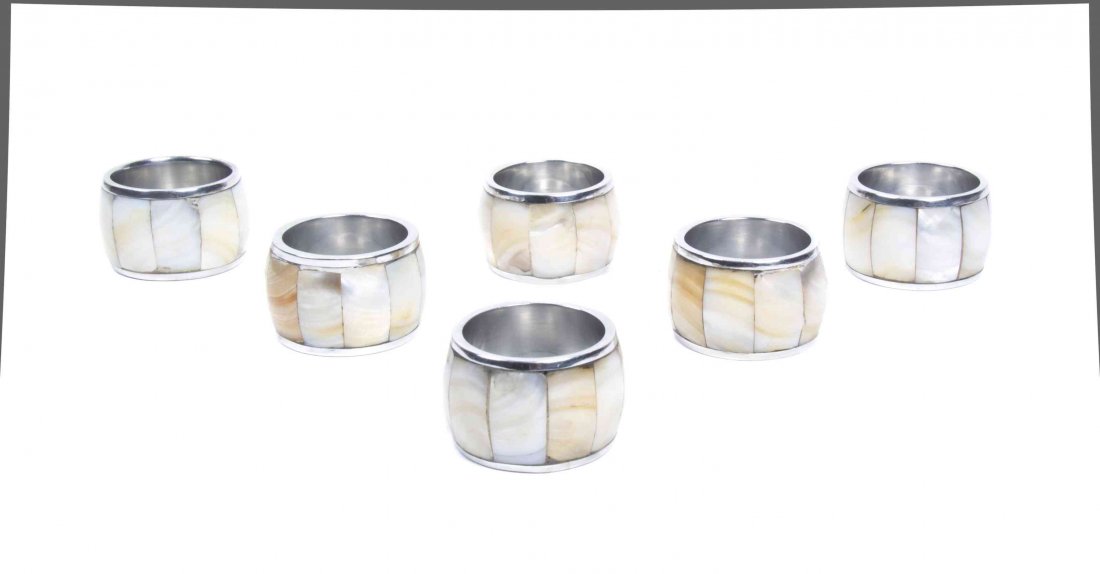 Six Mother-of-Pearl Napkin Rings. Diameter 1 5/8: Six Mother-of-Pearl Napkin Rings. Diameter 1 5/8 inches.