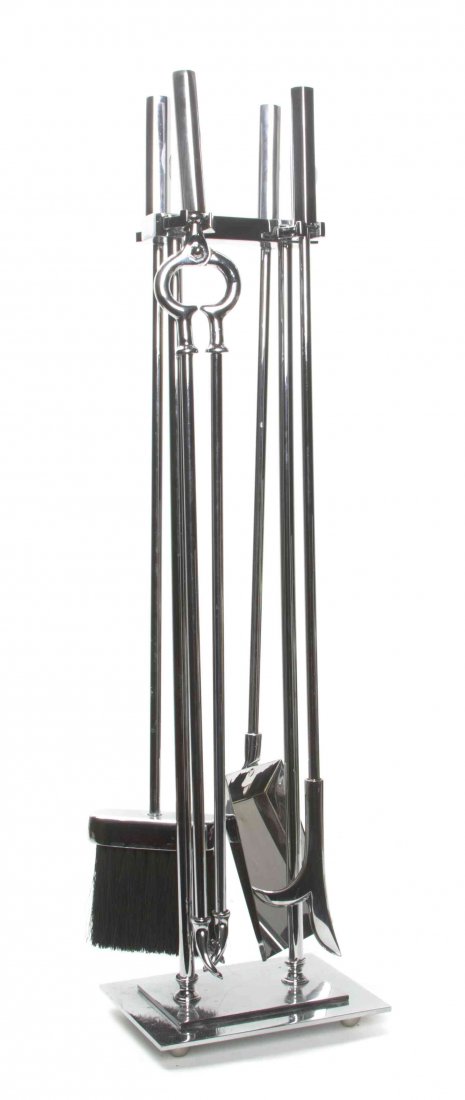 A Set of Five Chromed Fire Tools, Height of first 25: A Set of Five Chromed Fire Tools, comprising a broom, a shovel, a pocker, and tongs. Height of first 25 5/8 inches. Property from the Frank Plevo Trust, Las Vegas, Nevada