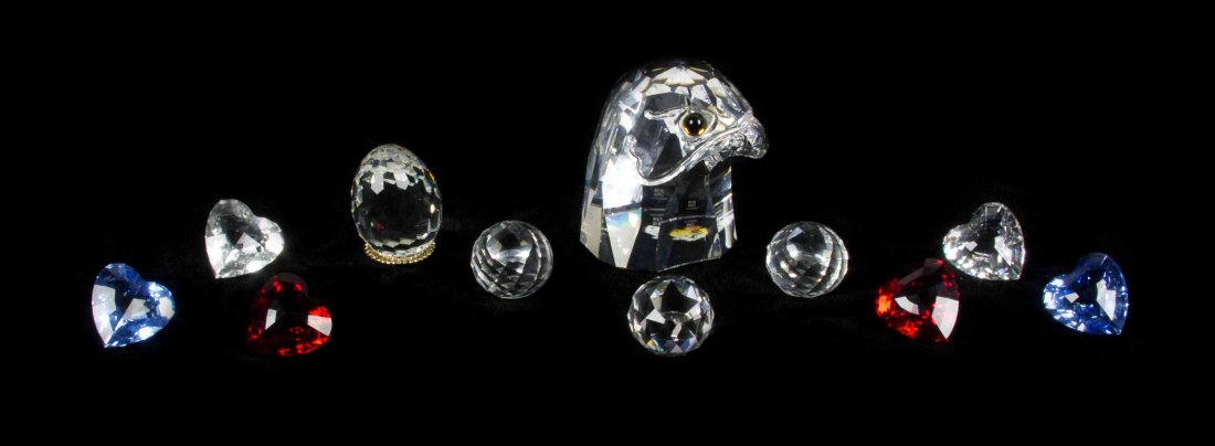 Eleven Swarovski Cut Glass Paperweights, Height of: Eleven Swarovski Cut Glass Paperweights, in the form of an eagle, hearts, eggs, and spheres. Height of first 3 3/4 inches. Property from the Frank Plevo Trust, Las Vegas, Nevada