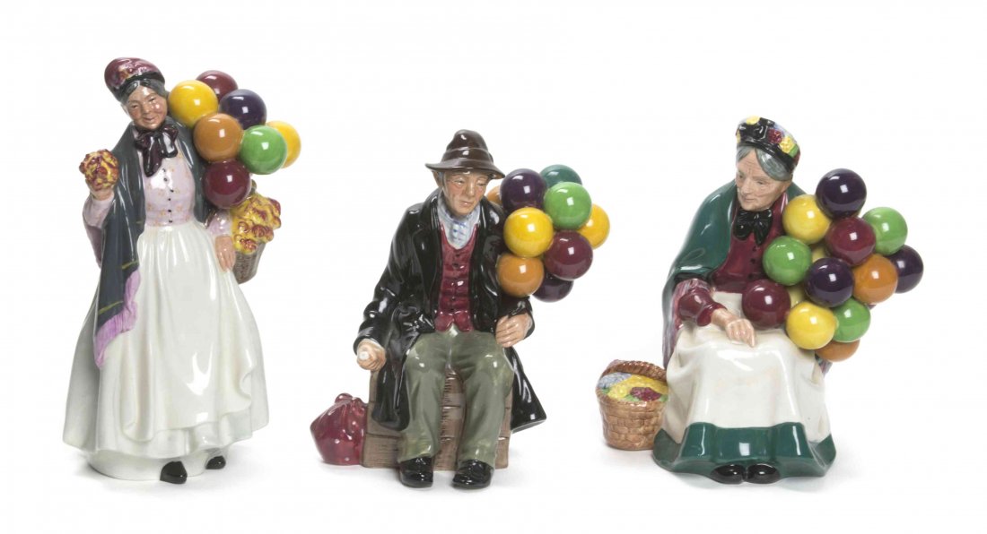 Three Royal Dalton Figural Groups, Height of first 8: Three Royal Dalton Figural Groups, comprising Biddy Pennyfarthing, The Old Balloon Seller and The Balloon Man. Height of first 8 3/8 inches. Property from the Frank Plevo Trust, Las Vegas, Nevada