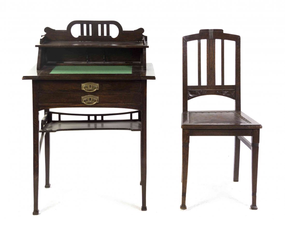 An Art Nouveau Oak Lady's Writing Desk, Height 40 1/2 x: An Art Nouveau Oak Lady's Writing Desk, having a rectangular felt inset top, surmounted by a shelf with segmented open compartments, above two long drawers, raised on square tapering legs joined by st
