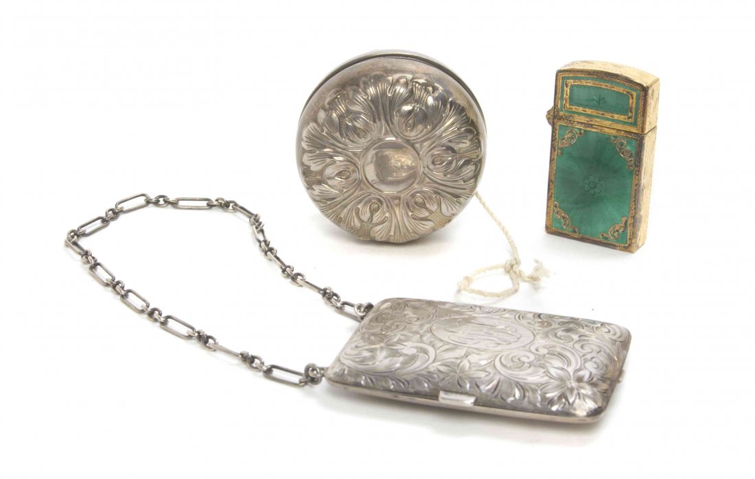 Three Silver Table Articles, , comprising a gilt silver: Three Silver Table Articles comprising a gilt silver enameled lighter case, marked 800, a silver yo-yo, Gorham Mfg. Co., and a silver compact with bright cut scrolling foliate decoration, Watrous Mfg.