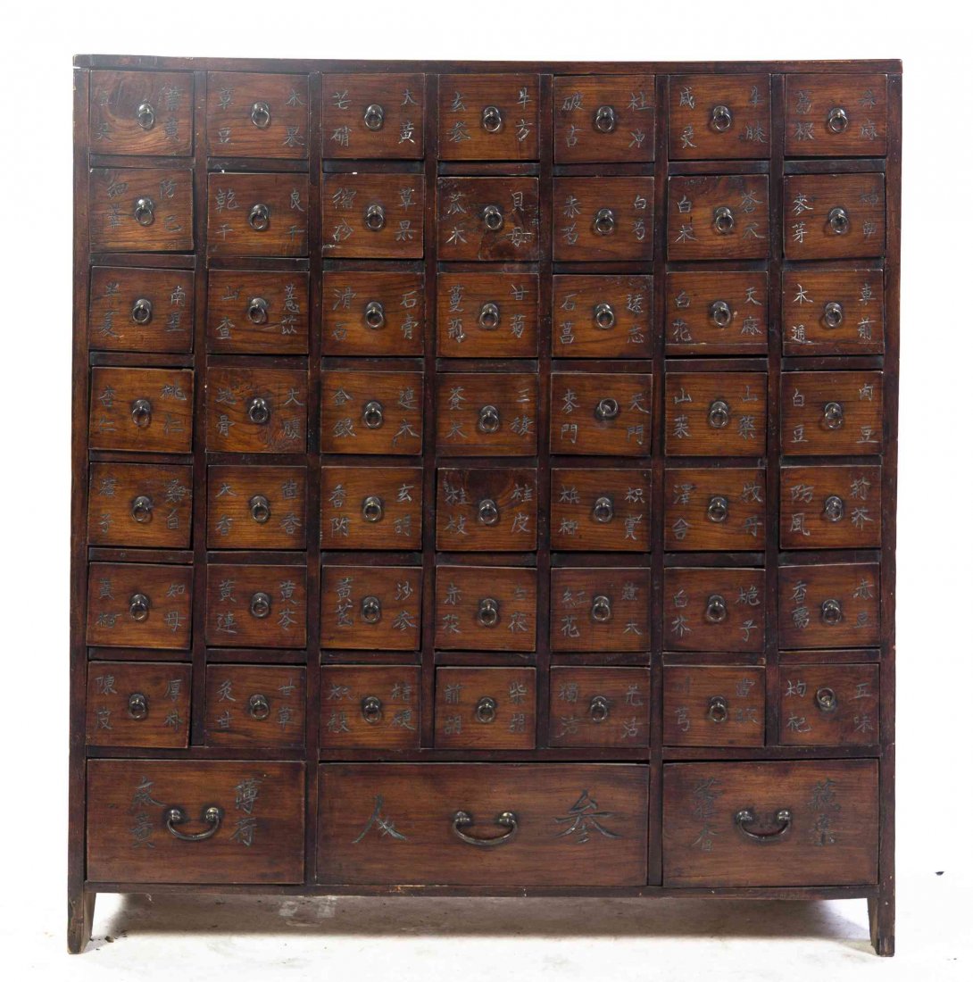 A Chinese Apothecary Chest, Height 38 1/2 x width 35 x: A Chinese Apothecary Chest, together with a Chinese chest with sliding doors. Height 38 1/2 x width 35 x depth 13 inches. Property from the May Weber, M.D., Collection, Chicago, Illinois to benefit th