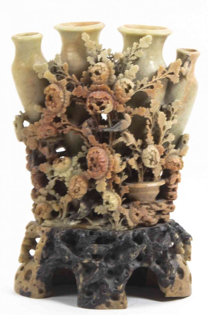 A Chinese Soapstone Carving, Height 10 1/8 inches.: A Chinese Soapstone Carving, in the form of four baluster vases, decorated with birds on flowering peony branches, raised on a conforming base with birds in various poses carved in relief. Height 10 1