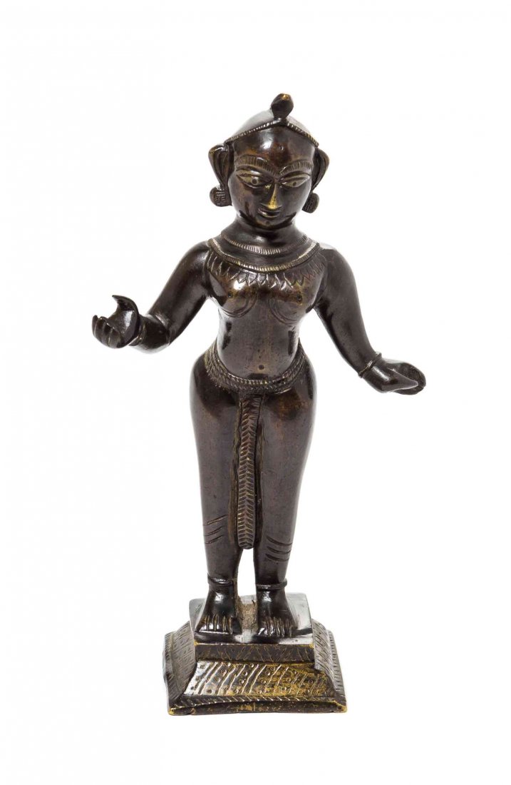 An Indian Bronze Figure, Height 7 1/2 inches.: An Indian Bronze Figure, depicted standing, apparently lacking a handheld impliment. Height 7 1/2 inches.