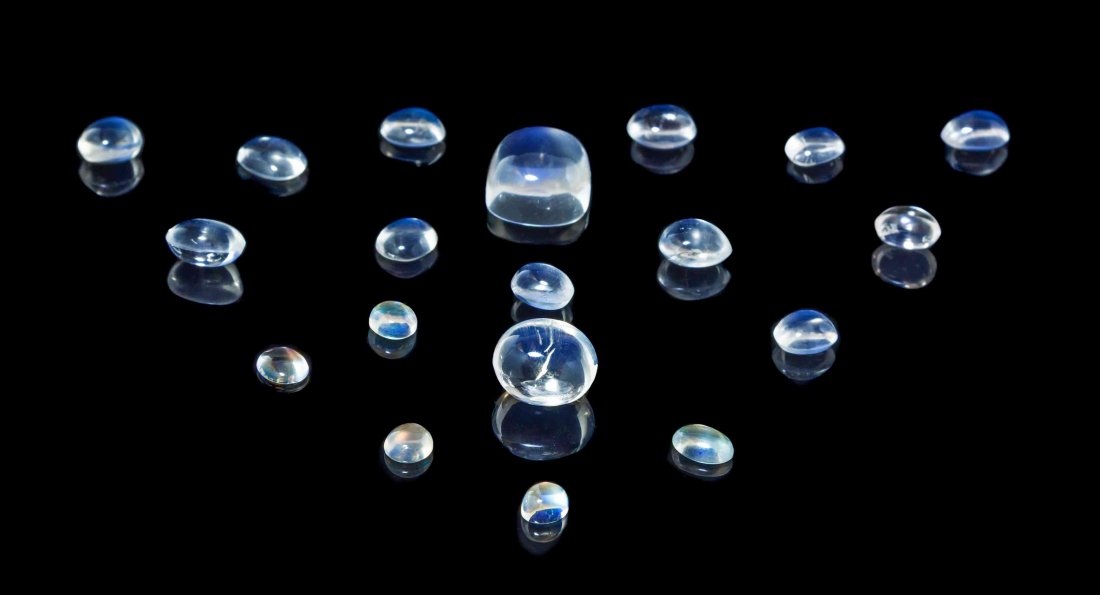 A Collection of Moonstones,, , including 19 fine: A Collection of Moonstones, including 19 fine cabochon cut moonstones, weighing up to 16.50 carats individually, displaying moderate to very strong blue adularescence, the vast majority of excellent c