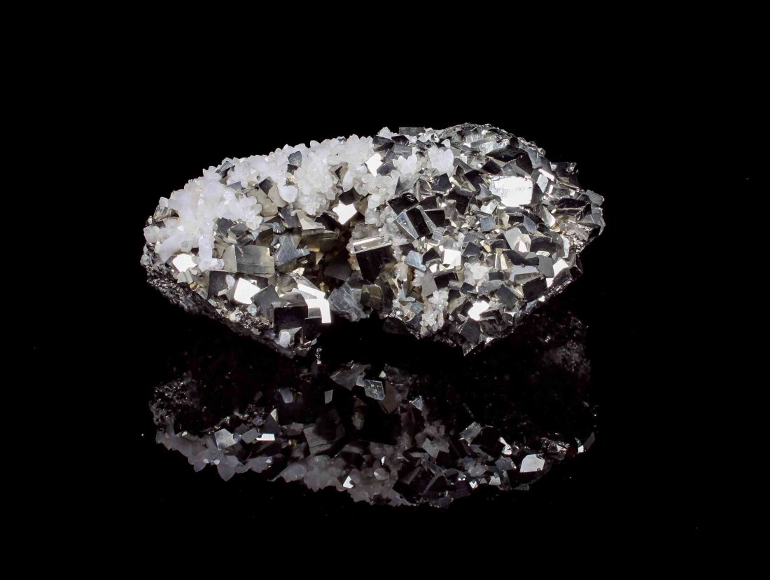 A Pyrite with Quartz Specimen,, , a plate of large: A Pyrite with Quartz Specimen, a plate of large lustrous cubic pyrite crystals of bright golden color partially overgrown with milky quartz crystals. 25.40 x 20.30 x 8.90 cm. Property from the Estate