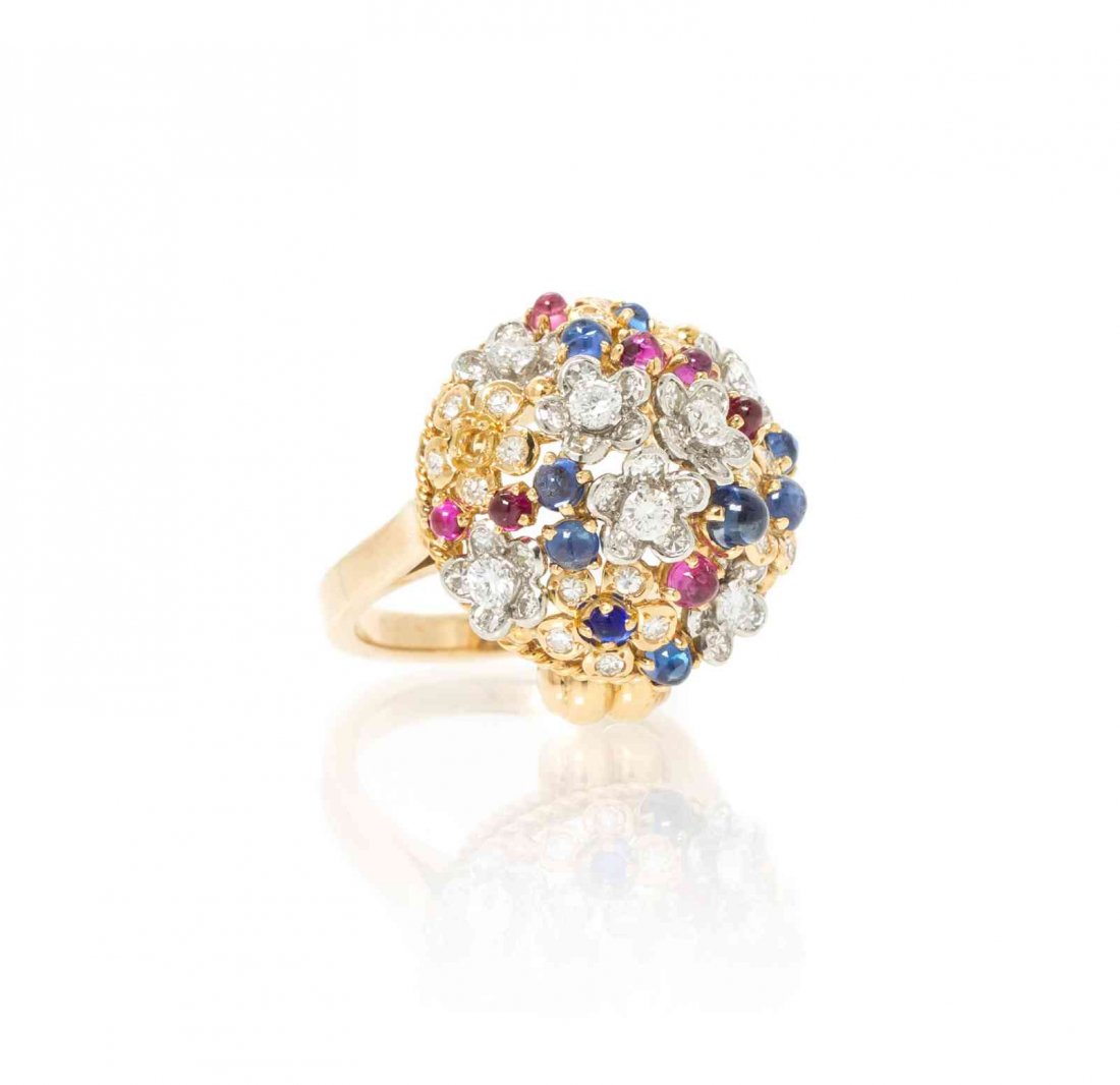 An 18 Karat Gold, Diamond, Sapphire and Pink Sapphire: An 18 Karat Gold, Diamond, Sapphire and Pink Sapphire Cluster Ring, in an openwork flower basket motif, containing seven round brilliant cut diamonds weighing approximately 0.49 carat total, 55 round