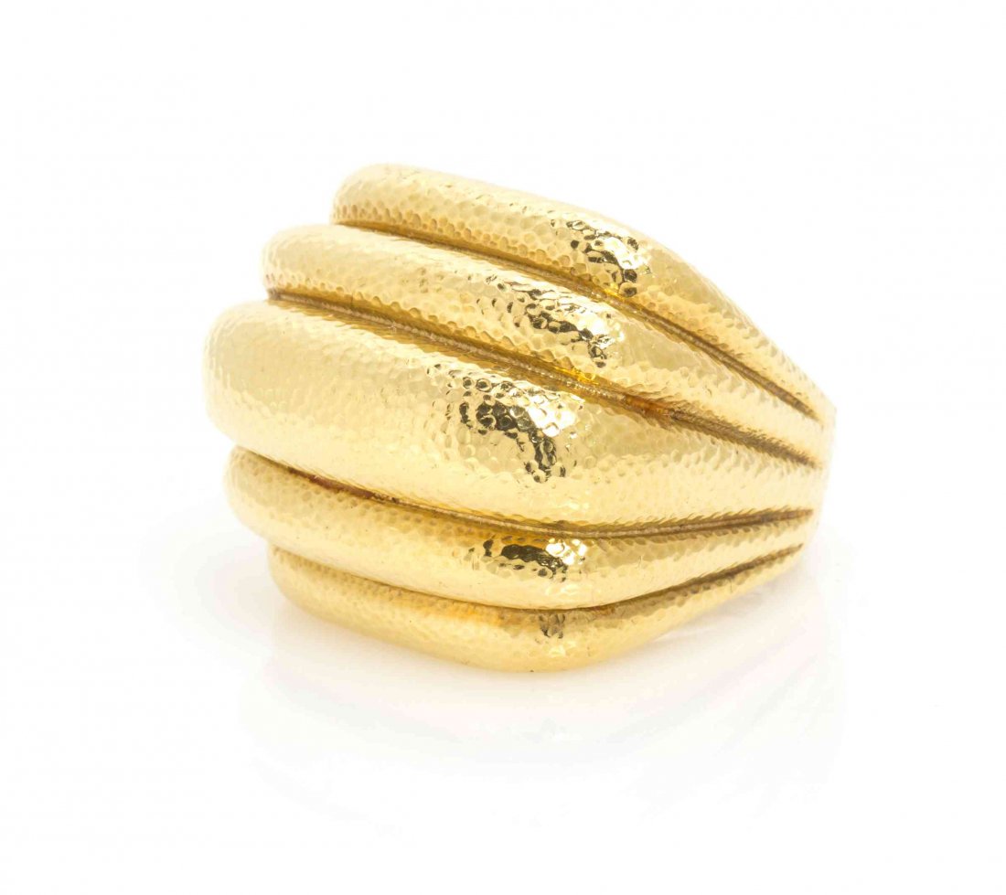 An 18 Karat Yellow Gold Ring, David Webb, 21.40 dwts.: An 18 Karat Yellow Gold Ring, David Webb, in a hammered texture graduated five lobe design. Stamp: 18K WEBB. 21.40 dwts. Property from the Collection of Violet Soffer, Boca Raton, Florida Condition: R