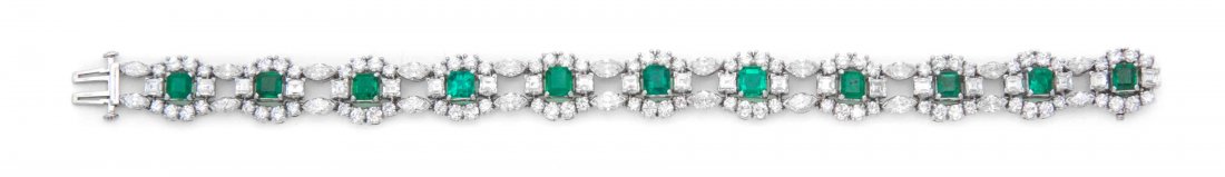 A Vintage Platinum, Emerald and Diamond Bracelet, Oscar: A Vintage Platinum, Emerald and Diamond Bracelet, Oscar Heyman Brothers, consisting of 11 cluster setting links joined by a double row of marquise links, the bracelet containing 11 octagonal step cut 