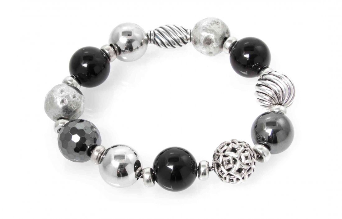 A Sterling Silver, Onyx and Hematite Elements Bead: A Sterling Silver, Onyx and Hematite Elements Bead Bracelet, David Yurman, consisting of two hammered textured silver beads, two polished silver beads, one pierced patterned silver bead, three onyx be