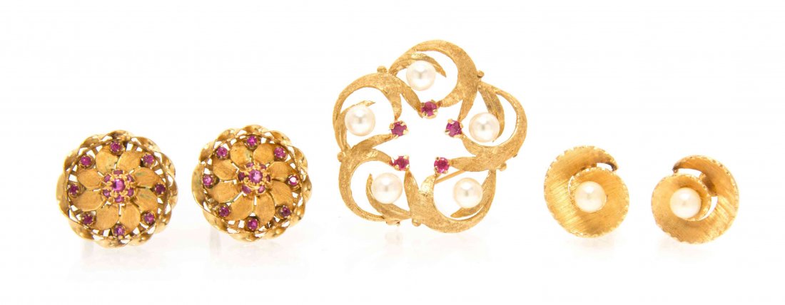 A Collection of Yellow Gold, Pearl and Ruby Jewelry,: A Collection of Yellow Gold, Pearl and Ruby Jewelry, consisting of a circle brooch in a polished and satin finish with floral motif containing 30 round mixed cut rubies, a yellow gold, ruby & cultured